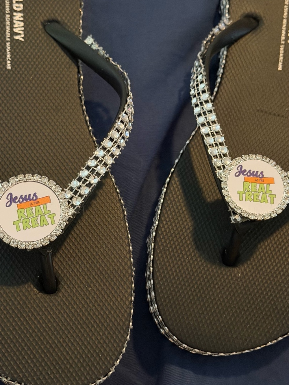 Women’s Black Rhinestone Flip Flops - 'Jesus is the Real Treat'